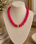 Elle Beaded Necklace with bright pink beads and a polished gold-tone center bead