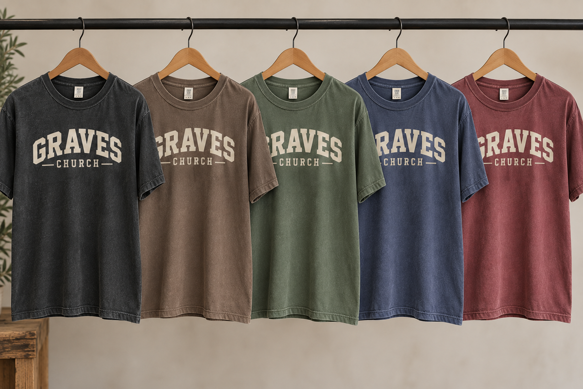 Graves Church graphic tees displayed together on a clothing rack